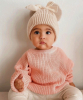 Beige bow winter hat with pompoms