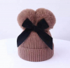 Brown bow winterhat with pompons 