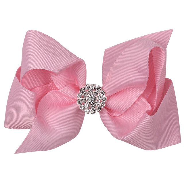Pink bow hairclip with rhinestones