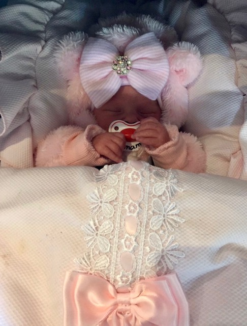 Newborn hat with pink bow and pink rhinestones